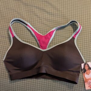 Women's Racerback Sports Bra in Gray and Pink with light blue trim.